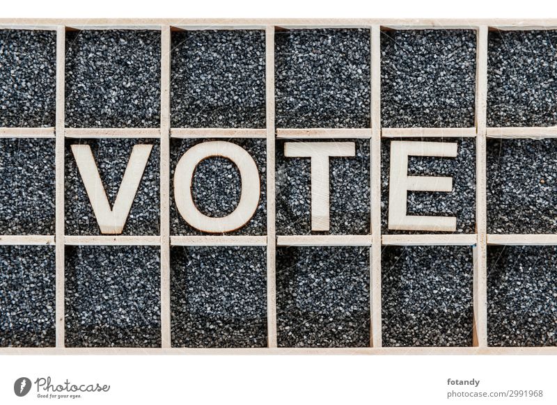 Wooden word VOTE on black sand Blackboard Career Sign Characters Select Brown White Creativity Arrangement Politics and state Trust Know Letters (alphabet) vote