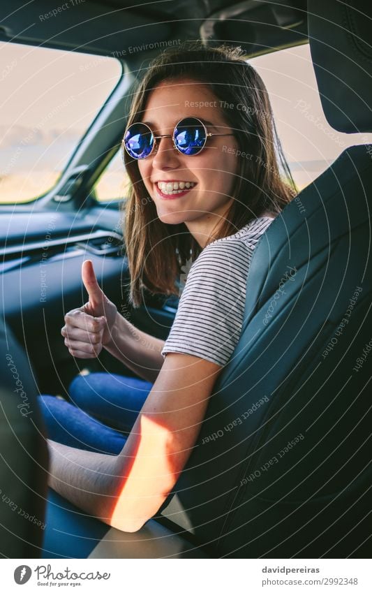 Girl doing thumbs up in the car Lifestyle Joy Happy Beautiful Leisure and hobbies Vacation & Travel Trip Human being Woman Adults Coast Transport Vehicle Car