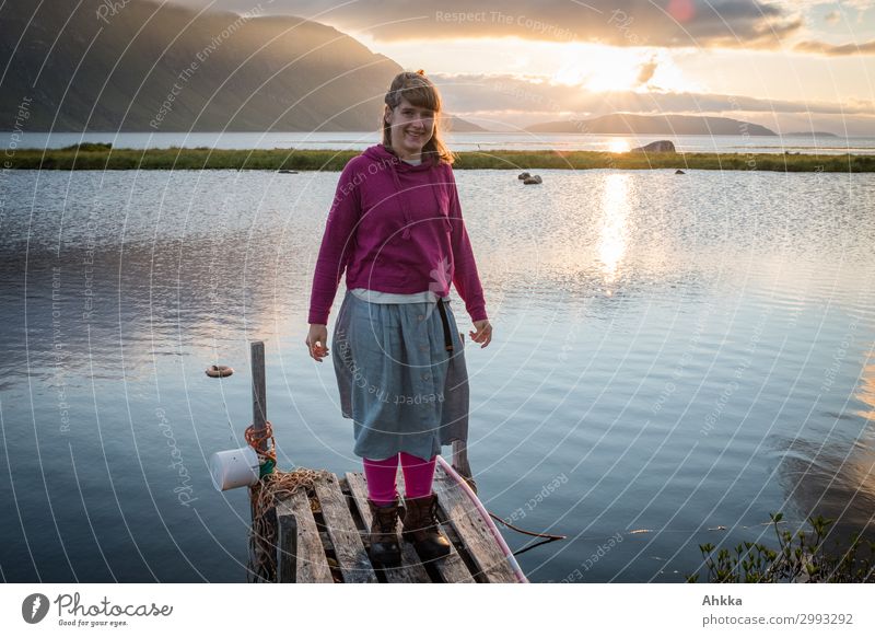Young woman on small wooden walkway. Fjord. midnight sun Joy Vacation & Travel Adventure Youth (Young adults) Wind Bay Ocean Arctic Ocean Lake Midnight sun