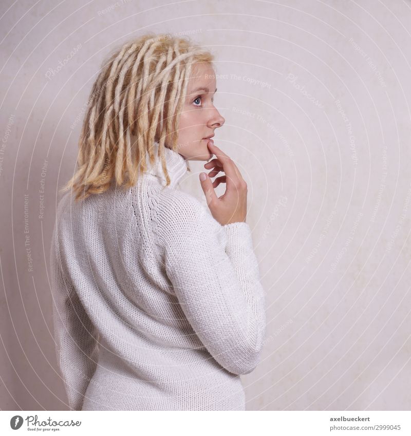 thoughtful woman with blond dreadlocks Lifestyle Human being Feminine Young woman Youth (Young adults) Woman Adults 1 18 - 30 years Subculture Sweater