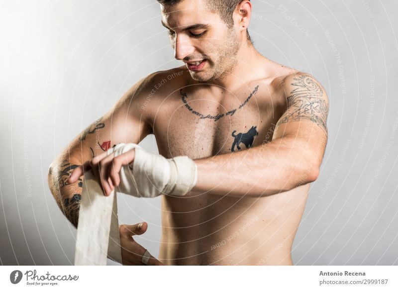 Muai thai fighter posing in studio shot with tattoos Sports Boy (child) Man Adults Ring Tattoo Gloves Fitness Aggression Strong Anger Power Protection Force