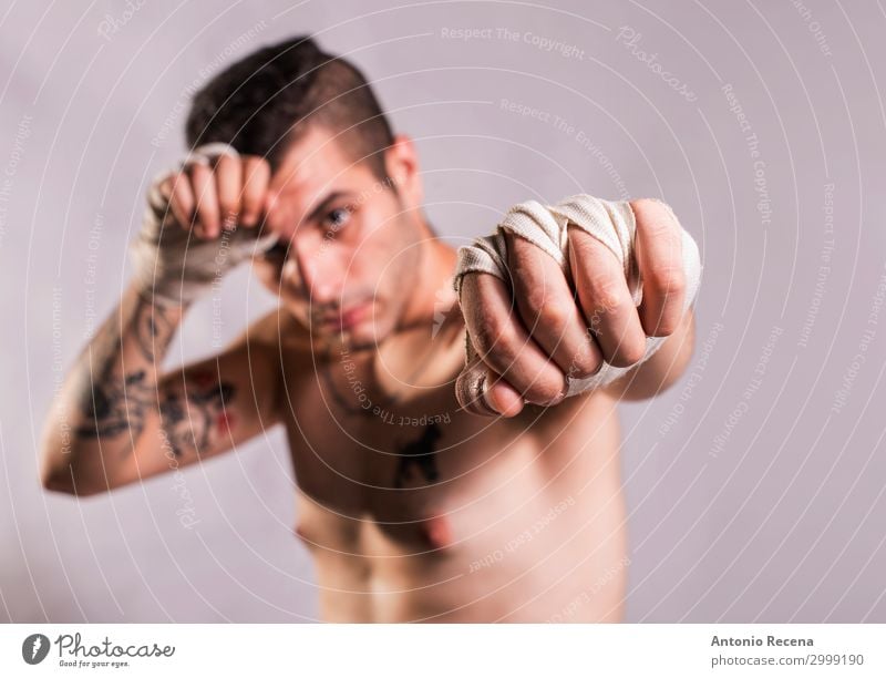 Muai thai fighter posing in studio shot with tattoos Sports Boy (child) Man Adults Ring Tattoo Gloves Fitness Aggression Strong Anger Power Protection Force