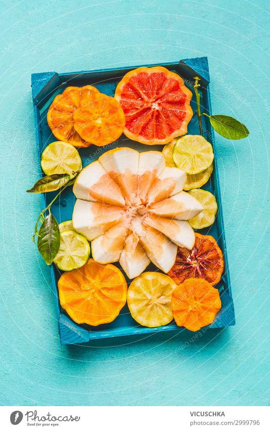 Various colorful citrus fruits with green leaves . Food Fruit Orange Nutrition Organic produce Diet Juice Lifestyle Style Healthy Eating Yellow Design