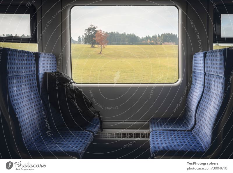 Train interior with chairs and backpack at window Vacation & Travel Tourism Trip Chair Industry Business Autumn Transport Means of transport Public transit