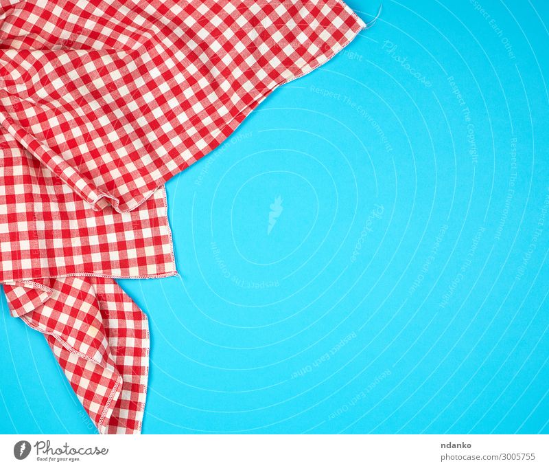 white red checkered kitchen towel on a blue background - a Royalty Free  Stock Photo from Photocase
