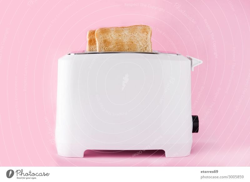 Toasted Toast Bread In Toaster On Pink Background A Royalty Free Stock Photo From Photocase