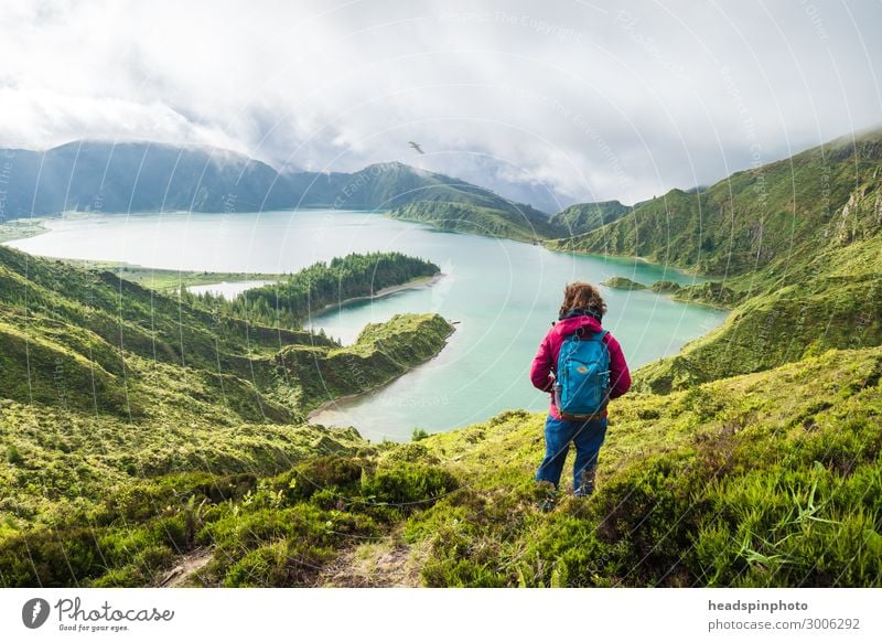 Young woman with rucksack in front of a mountain lake in the Azores Joy Happy Vacation & Travel Tourism Trip Adventure Far-off places Freedom Expedition Island
