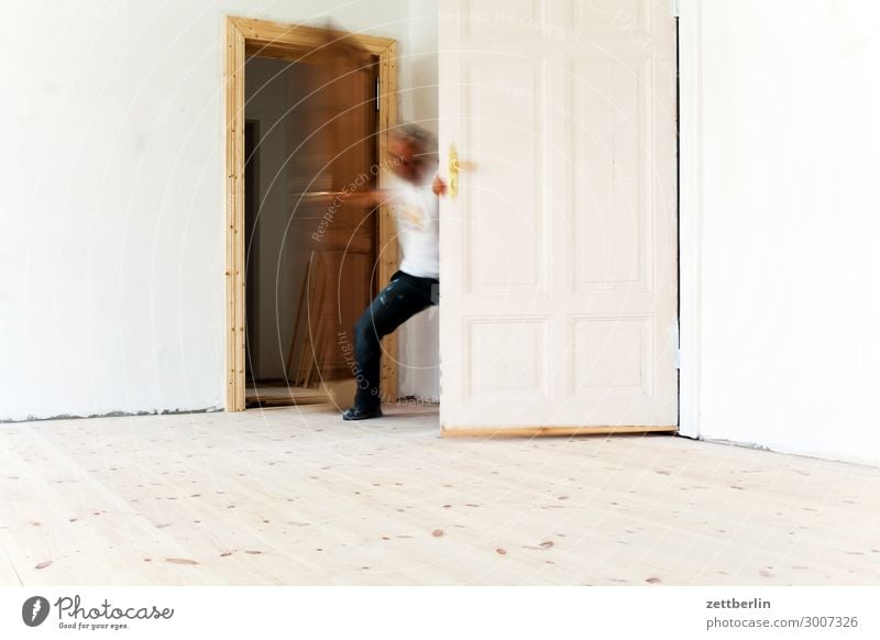 Arrival again Old building Period apartment Motion blur Hallway Wooden floor Floor covering Man Wall (barrier) Human being Room Interior design Copy Space