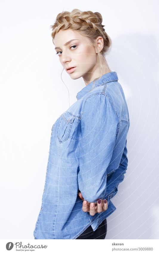 Premium Photo | Young beautiful fashion model with natural makeup and wavy  hairstyle wearing a denim jacket on the b...