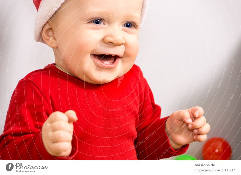 so happy Human being Masculine Child Toddler 1 1 - 3 years Hat Laughter Sit Happy Red Joy Happiness Joie de vivre (Vitality) Christmas & Advent Santa Claus hat