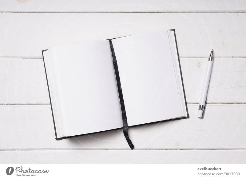Notebook with black paper and white pen opened with page and white on black  text - Stock Image - Everypixel