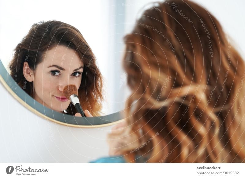young woman powders nose in mirror Lifestyle Beautiful Skin Face Cosmetics Make-up Living or residing Mirror Bathroom Human being Feminine Young woman