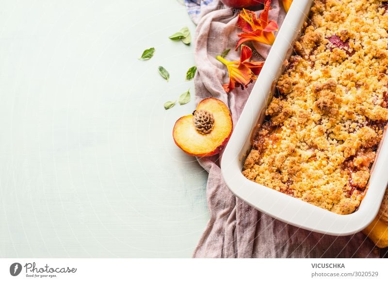 Yummy peach crumble dessert in baking pan on light background , top view. Copy space for your design or recipe yummy copy space plate cooking copyspace prepared