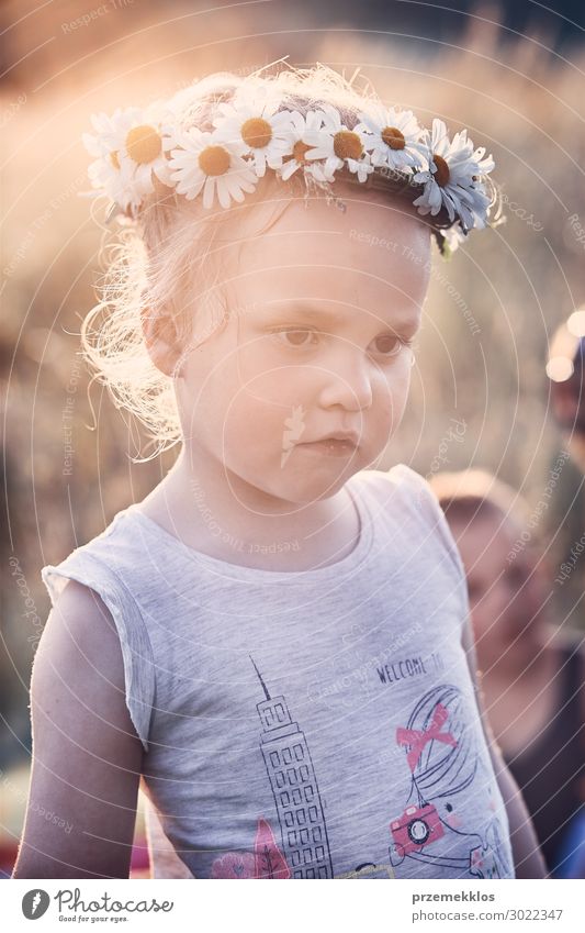 Little girl wearing a coronet of wild flowers on her head Lifestyle Joy Happy Relaxation Leisure and hobbies Playing Vacation & Travel Summer Child Human being