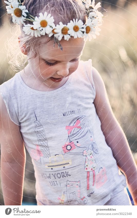 Little girl wearing a coronet of wild flowers on her head Lifestyle Joy Happy Relaxation Leisure and hobbies Vacation & Travel Summer Summer vacation Child