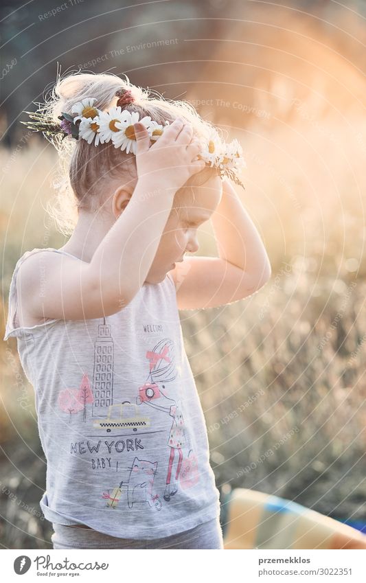 Little girl wearing a coronet of wild flowers on her head Lifestyle Joy Happy Relaxation Leisure and hobbies Playing Vacation & Travel Summer Child Human being