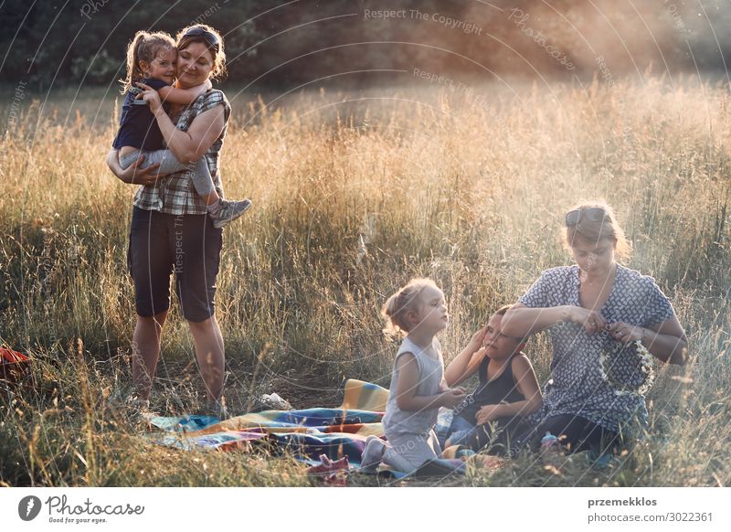Family spending time together on a meadow Lifestyle Joy Happy Relaxation Leisure and hobbies Vacation & Travel Summer Summer vacation Child Human being Girl