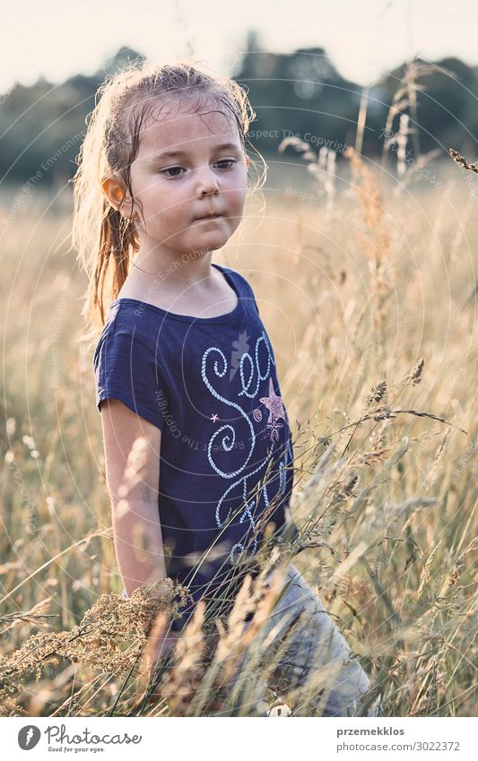 Little happy smiling girl playing in a tall grass Lifestyle Joy Happy Relaxation Vacation & Travel Summer Summer vacation Child Human being Girl 1 3 - 8 years