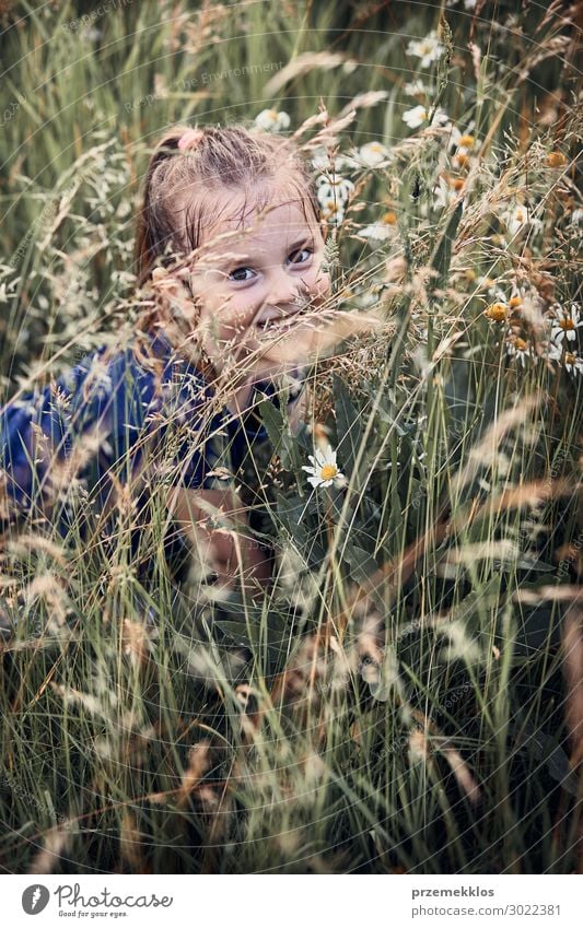 Little happy girl playing in a tall grass Lifestyle Joy Happy Relaxation Vacation & Travel Summer Summer vacation Child Human being Girl 1 3 - 8 years Infancy