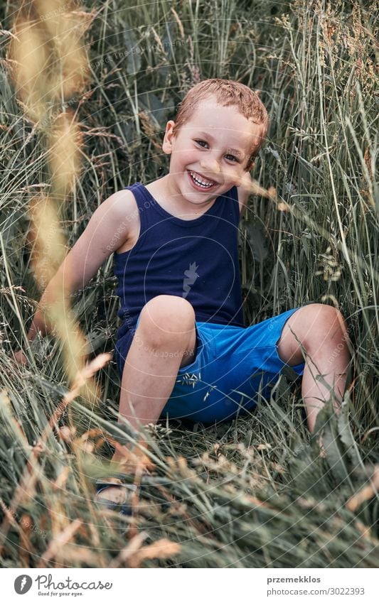 Little happy smiling kids playing in a tall grass Lifestyle Joy Happy Relaxation Vacation & Travel Summer Summer vacation Child Human being Boy (child) 1