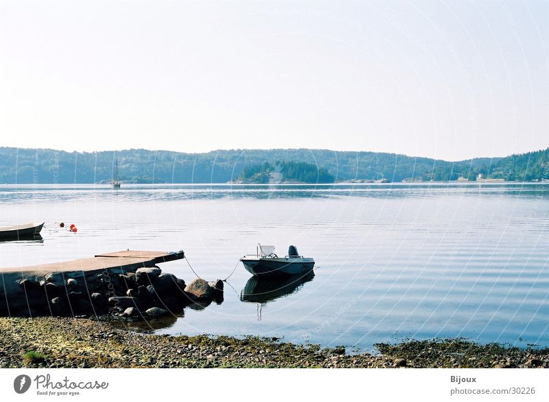 The lake rests still Watercraft Lake Footbridge Calm Loneliness Scandinavia Fjord Sweden Coast