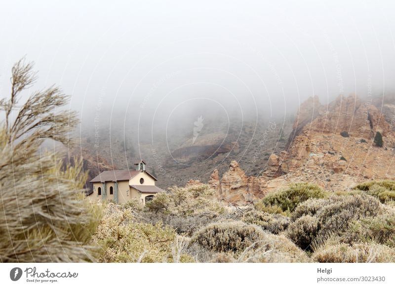 small church in the National Park Teide on Tenerife, in the middle of a bizarre landscape with plants and clouds of fog Vacation & Travel Tourism Trip