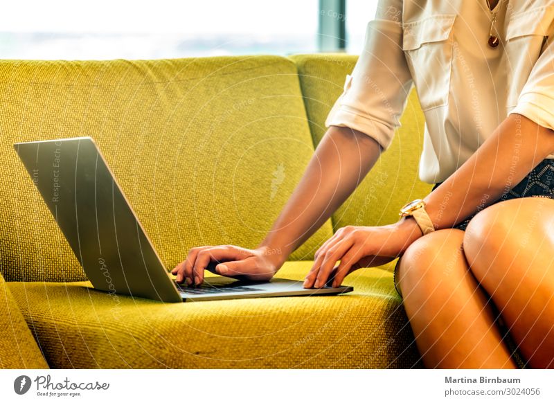 Close-up of a young woman using a laptop at home Luxury Beautiful Sofa Academic studies Work and employment Office Business Computer Notebook Technology