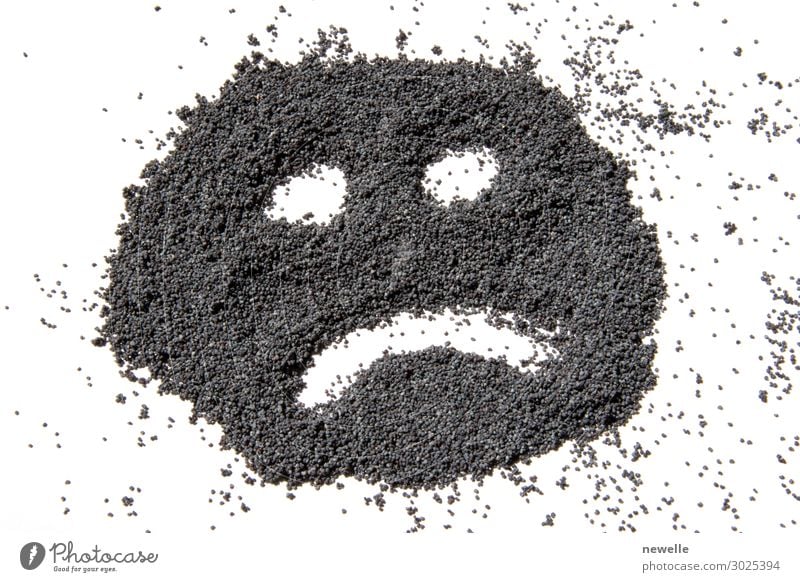 unhappy face made from dried poppy seeds Food Herbs and spices Nutrition Eating Face Sadness Black White bio Poppy background opium Raw space copy Tasty