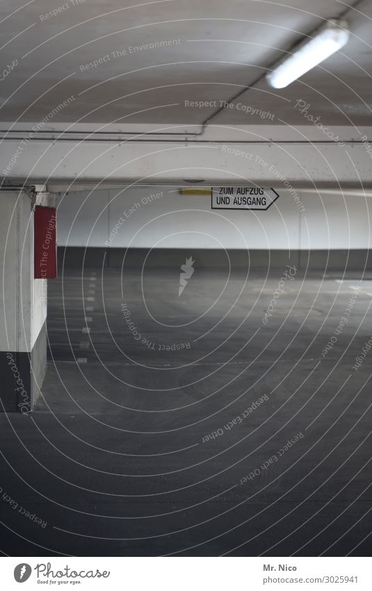 Parking level U3 Town Parking garage Wall (barrier) Wall (building) Cold Gray Empty Parking lot Way out Elevator Signage Concrete floor Lamp Neon light