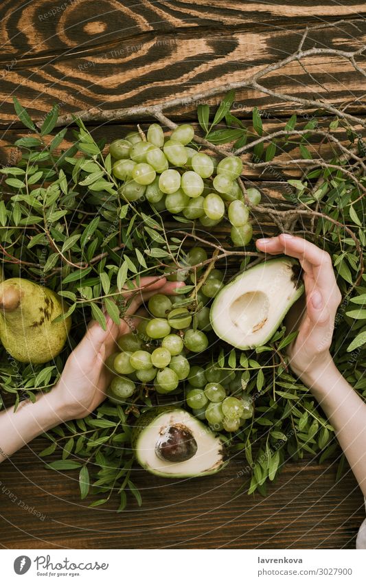 woman's hands holding grapes, pears and avocados Agriculture Avocado Branch Farm Woman flat lay Food Healthy Eating Food photograph Fresh Fruit Garden