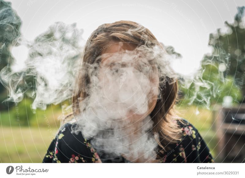 Smoke shrouds the face of the young woman Smoking Intoxicant Feminine 1 Human being Nature Sky Summer Fog Tree Grass Garden Exhaust gas Smoke cloud To enjoy