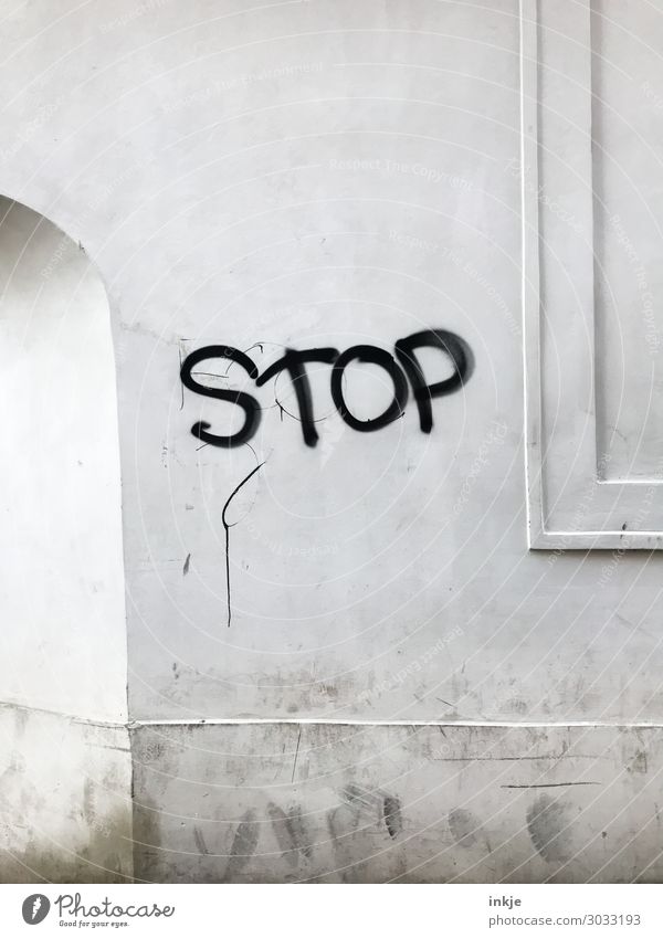 STOP Deserted Wall (barrier) Wall (building) Facade Passage Archway Window frame Characters Graffiti Simple Town Gray Black White Stop Bans Colour photo