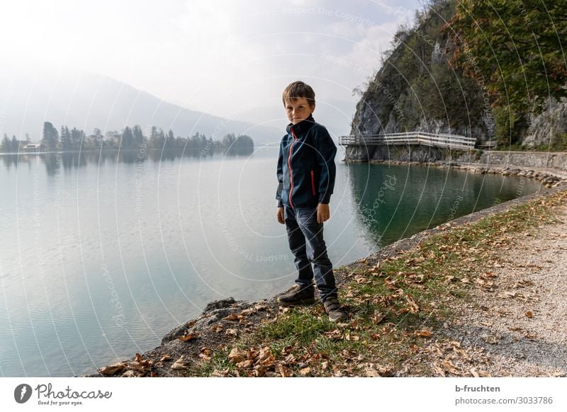 Alone at the lake Child 1 Human being 3 - 8 years Infancy Environment Nature Clouds Autumn Fog Alps Mountain Lakeside Relaxation Going Stand Hiking Wait