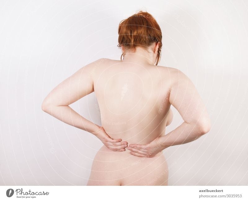 Back pain concept - Beautiful nude woman with huge boobs has back pain  Stock Illustration