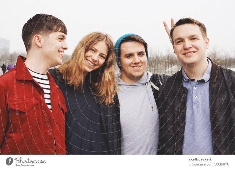 Four friends posing arm in arm Lifestyle Joy Leisure and hobbies University & College student Human being Masculine Feminine Young woman Youth (Young adults)