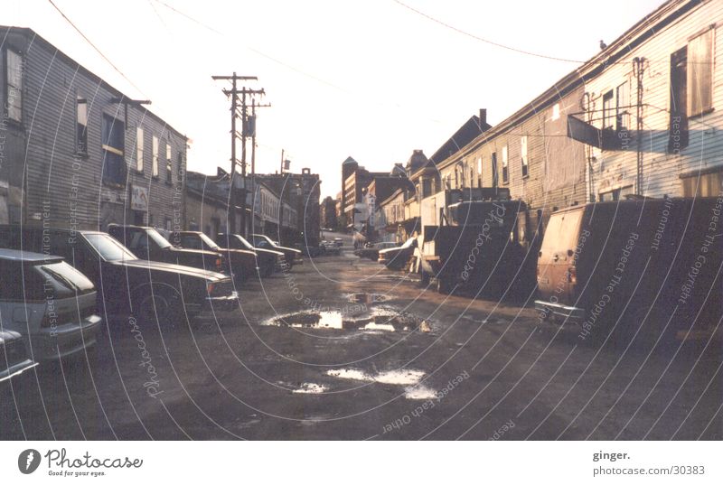 side street Street Gloomy Maine Sidestreet Puddle High voltage power line House (Residential Structure) Housefront Pothole Ghetto Analog Deserted