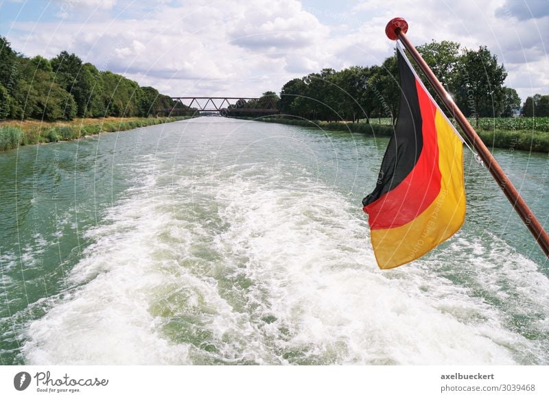Boat trip on Mittellandkanal with German flag Lifestyle Leisure and hobbies Vacation & Travel Tourism Trip Summer Waves River Transport Traffic infrastructure