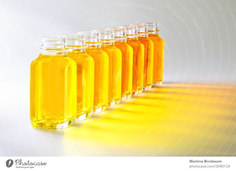 Download Bottles With Yellow Fluids In Different Shades Of Yellow A Royalty Free Stock Photo From Photocase PSD Mockup Templates
