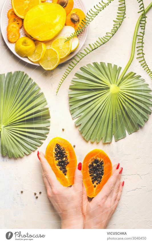 Hands holding the halved papaya Food Fruit Nutrition Breakfast Design Exotic Healthy Eating Woman Adults Hip & trendy Yellow Papaya Enzyme Papain Fruit flesh