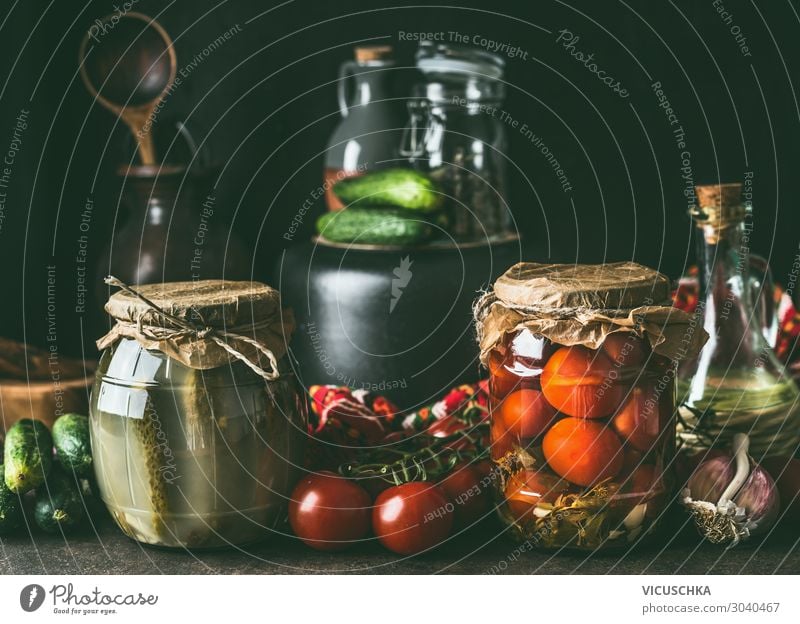 Preserving of fruits and vegetables harvest. Various preserve glass jars on dark table. Healthy way of harvest storage various healthy side view copy space