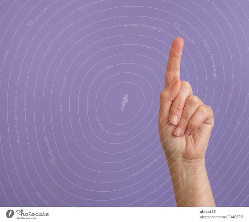 Hand with raised index finger on purple with copy space Human being Woman Adults Fingers Cool (slang) Multicoloured Violet 1 background communication