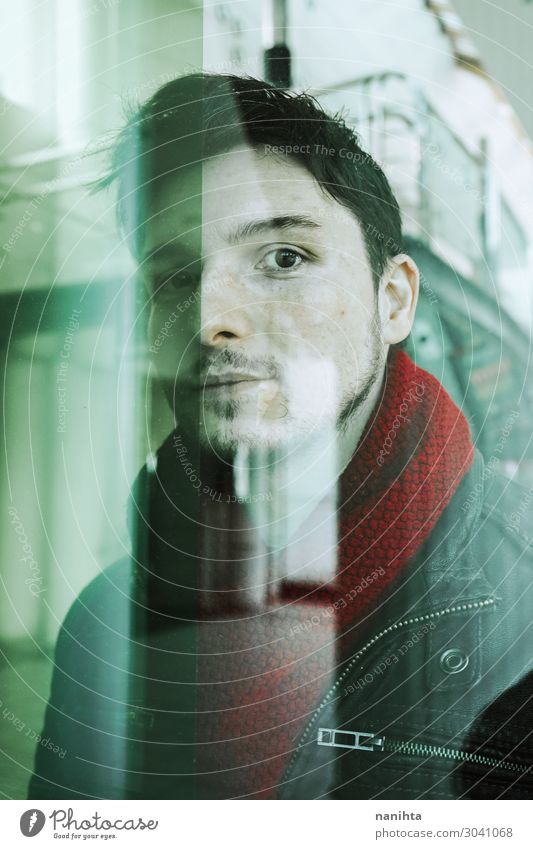 Young man looking throgh a window Face Winter Human being Masculine Youth (Young adults) Man Adults 1 30 - 45 years Town Scarf Hair and hairstyles Black-haired