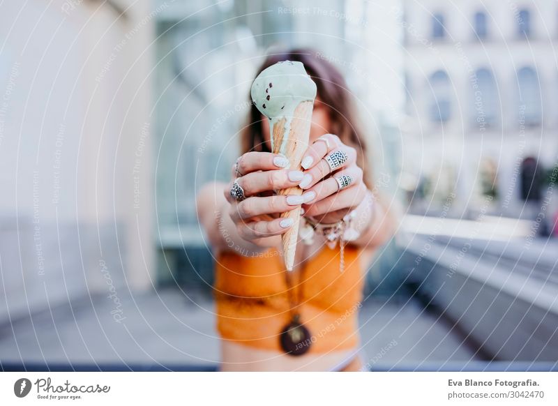 Beautiful young caucasian woman with mint ice cream at the city Ice cream Eating Spoon Lifestyle Joy Happy Leisure and hobbies Summer Feminine Young woman