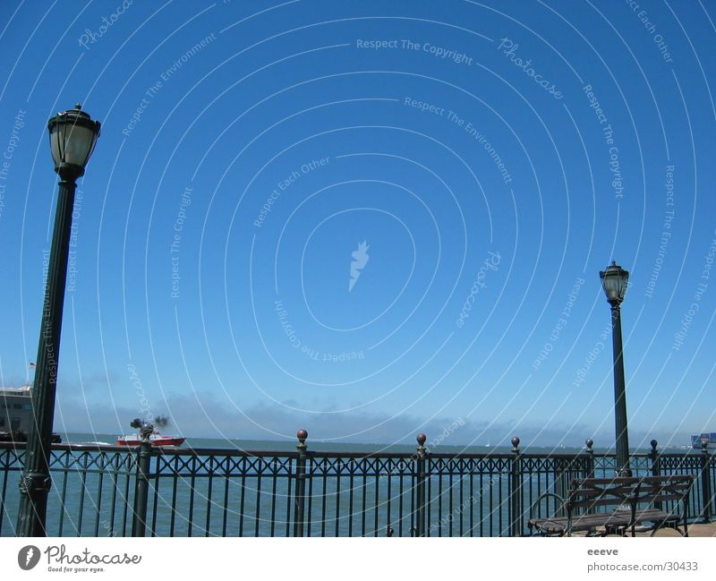 By the sea Ocean Pacific Ocean Jetty Americas San Francisco Sky Promenade Lamp post Blue sky Cloudless sky Clear sky Beautiful weather Deserted Handrail