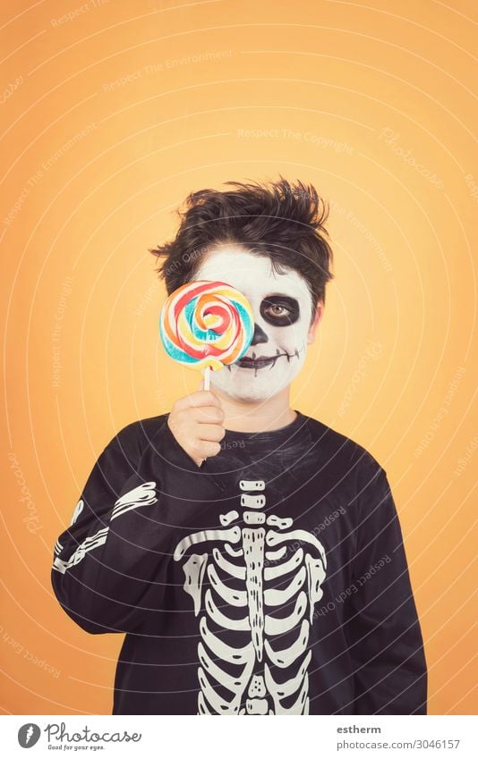 Happy Halloween.funny child in a skeleton costume Eating Joy Medical treatment Feasts & Celebrations Hallowe'en Child Infancy Autumn Smiling Dark Happiness Cute