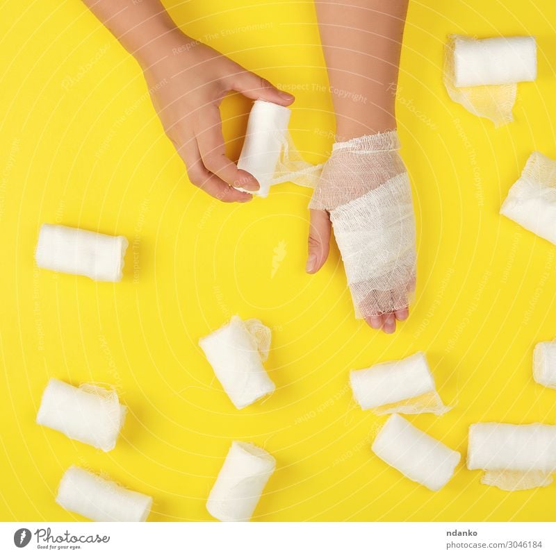 right hand wrapped with white gauze bandage Body Health care Medical treatment Illness Medication Human being Woman Adults Arm Hand Fingers Clean Yellow White