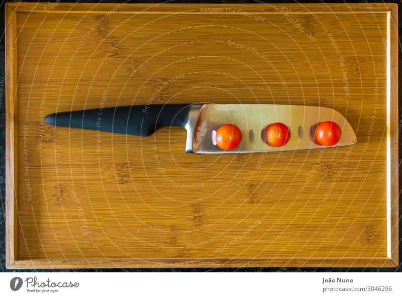 Balancing Cherry Tomatoes Over Chef's Knife Vegetable Lettuce Salad Nutrition Lunch Dinner Organic produce Vegetarian diet Diet Cutlery Fork Metal Steel Balance