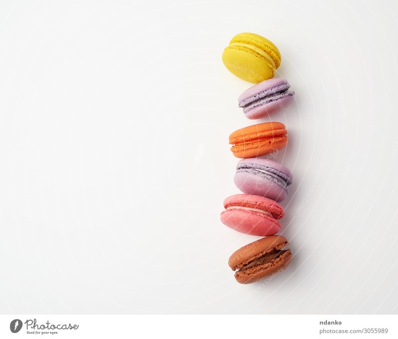 stack of colorful baked macaron Cake Dessert Candy Eating Fresh Delicious Above Brown Yellow Pink White Colour Tradition Stack Vanilla choice Almond Sugar cream