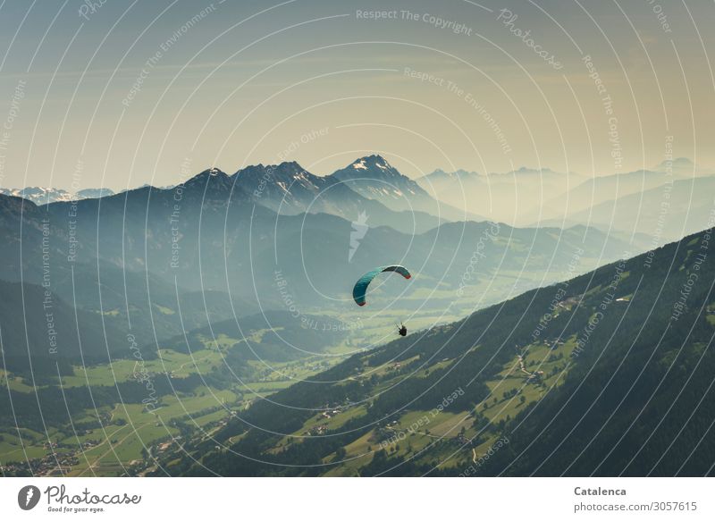 Looking for thermals, a paraglider hovers in the air looking for thermals Paragliding Environment Landscape Air Sky Cloudless sky Summer Beautiful weather Fog