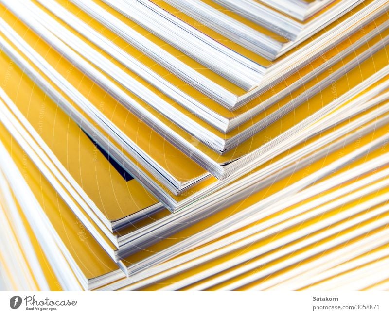 Stack of yellow monthly magazine Relaxation Reading Book Library Paper Piece of paper Collection New Yellow White Colour Accumulation background education Press